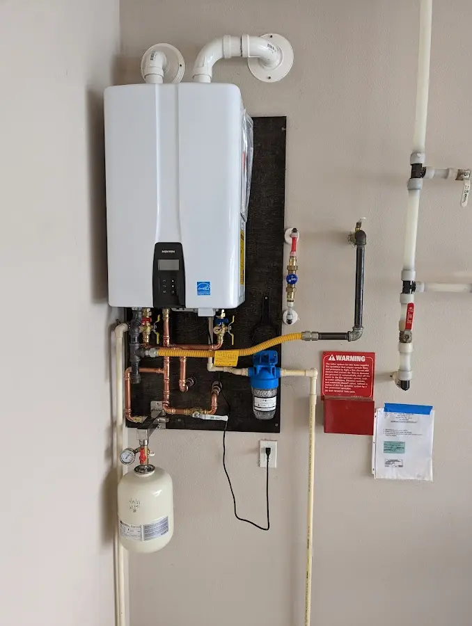 Professional plumber installing copper piping in a Sheffield home